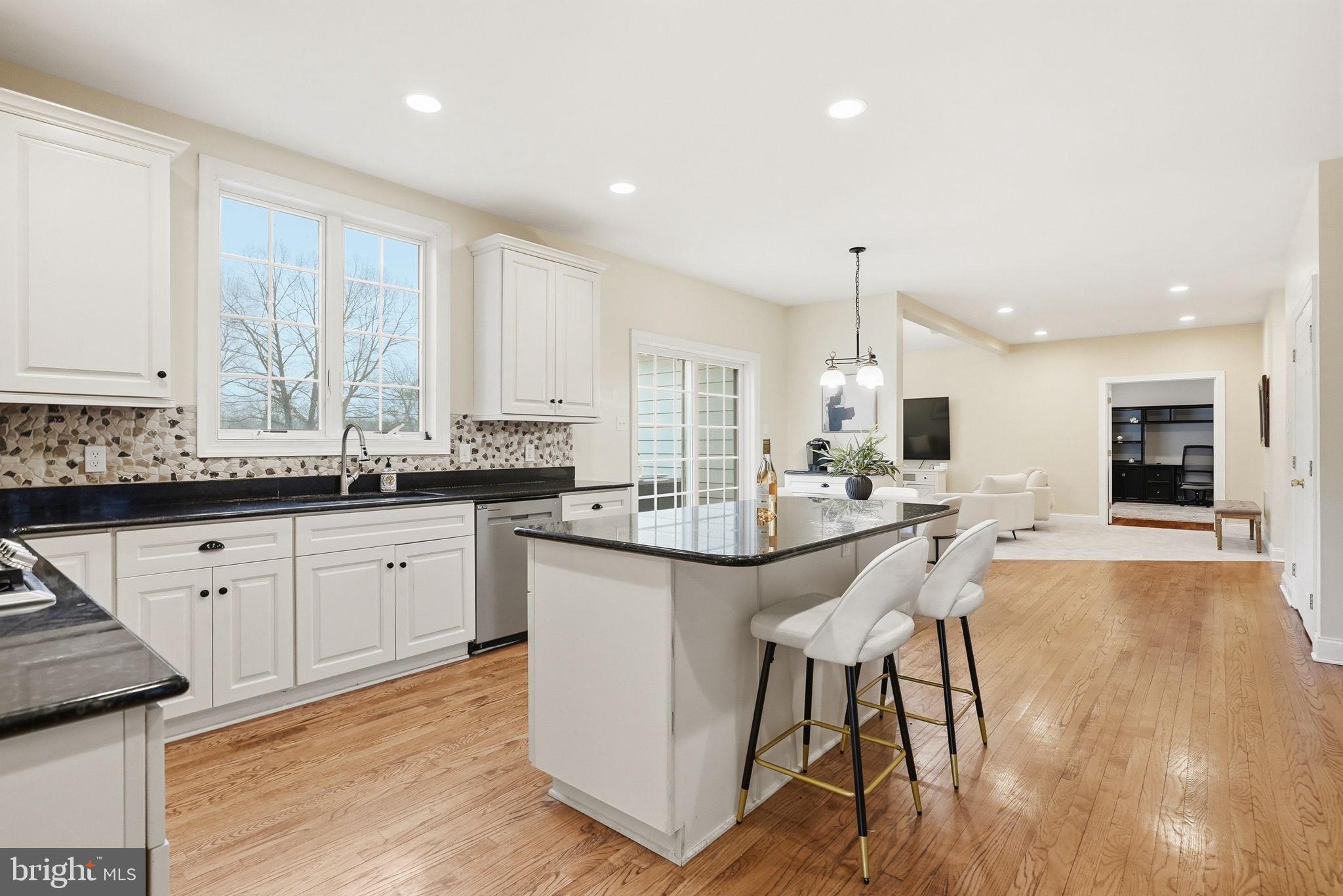 22 Springlea Lane Chester Springs, PA 19425 - Photo 23 of 80 a kitchen with stainless steel appliances kitchen island granite countertop a sink and cabinets