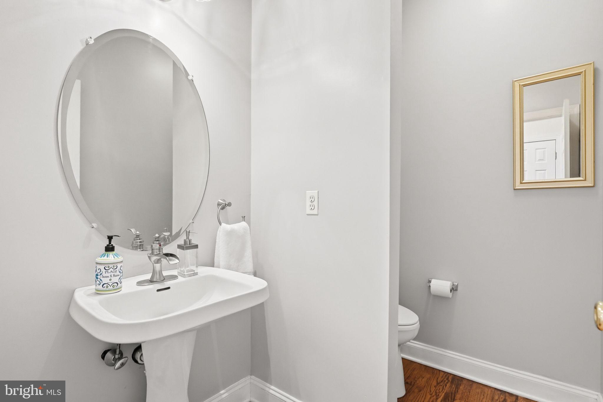 22 Springlea Lane Chester Springs, PA 19425 - Photo 27 of 80 a bathroom with a sink a toilet and a mirror