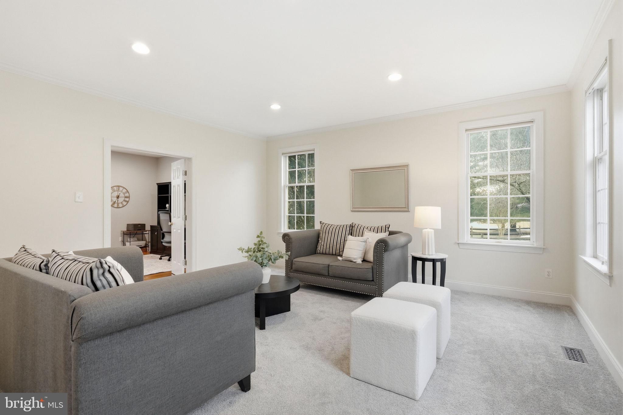 22 Springlea Lane Chester Springs, PA 19425 - Photo 29 of 80 a living room with furniture and a window