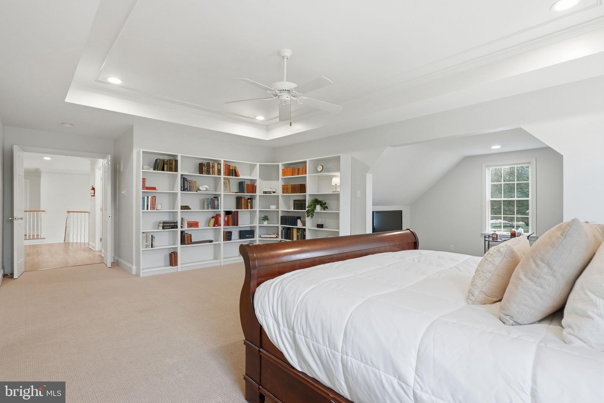 22 Springlea Lane Chester Springs, PA 19425 - Photo 42 of 80 a bedroom with a large bed and a book shelf