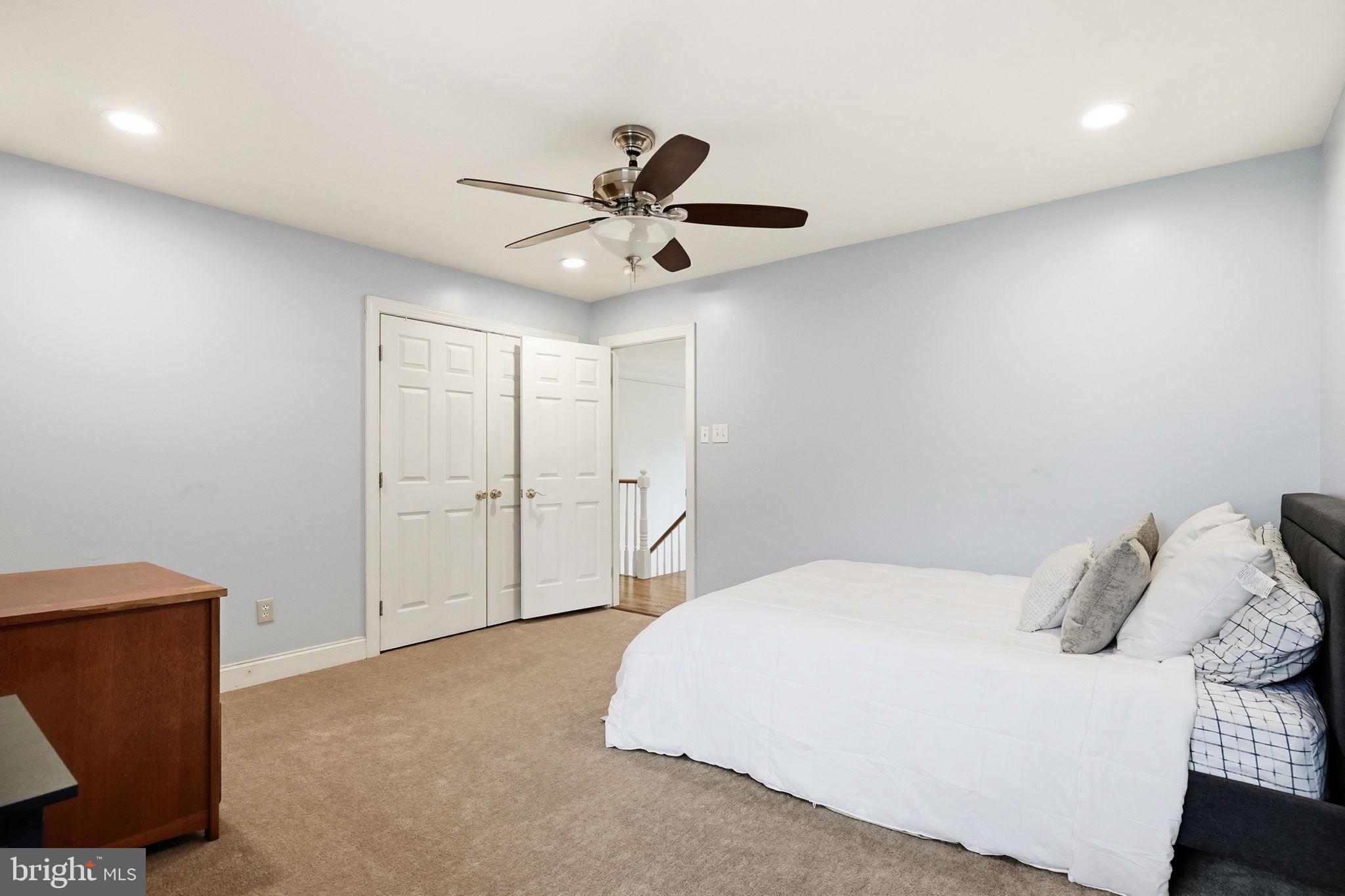 22 Springlea Lane Chester Springs, PA 19425 - Photo 53 of 80 a spacious bedroom with a bed and a ceiling fan