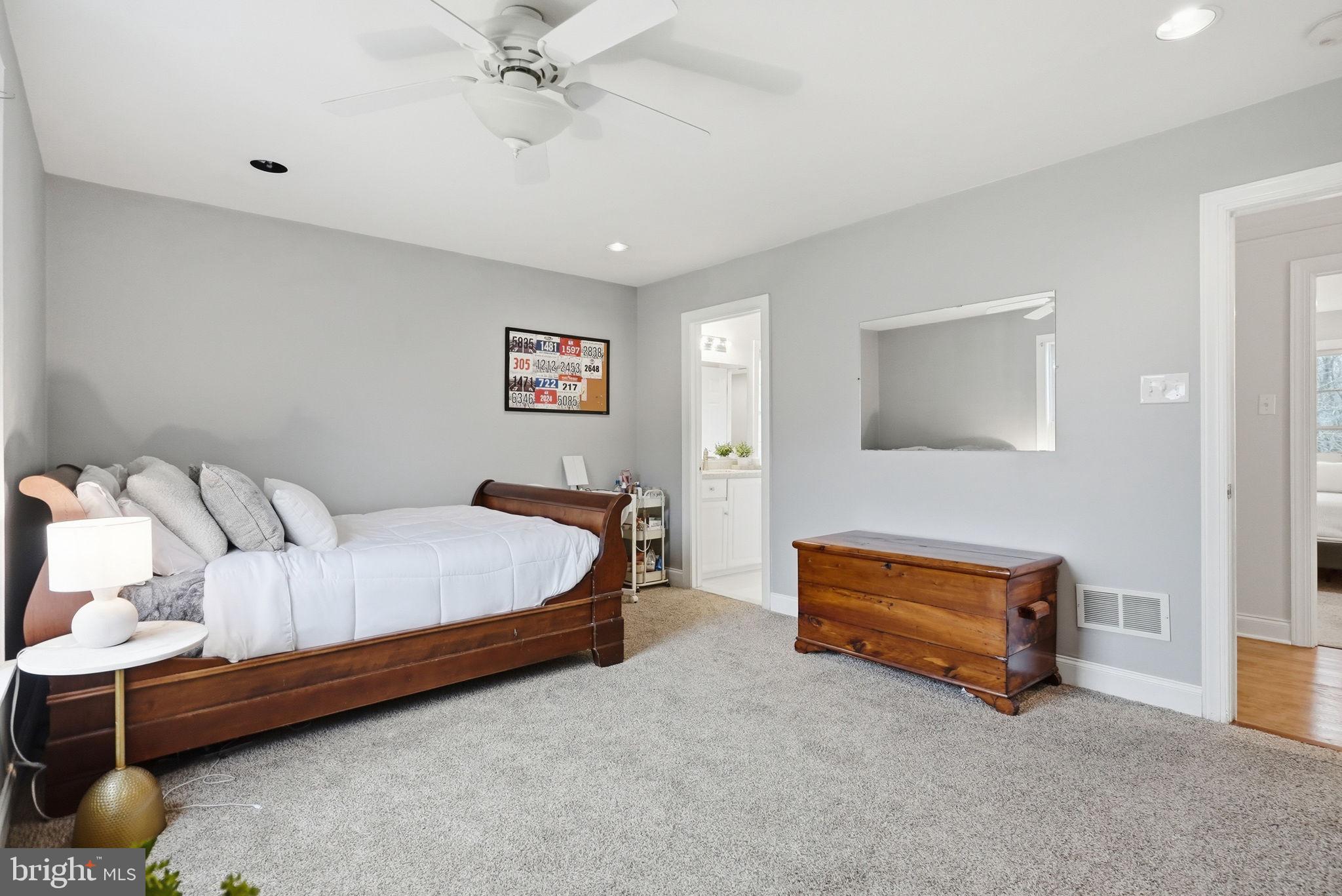 22 Springlea Lane Chester Springs, PA 19425 - Photo 61 of 80 a bedroom with a bed and a lamp on table