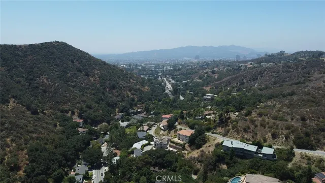 an aerial view of residential house and green space