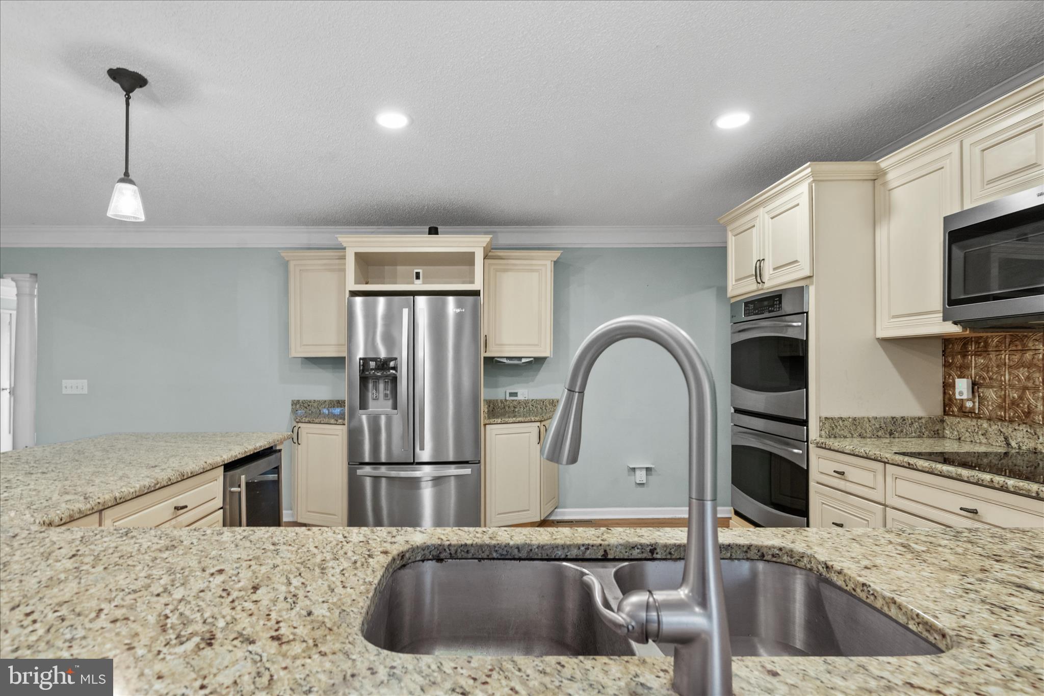12647 Old Stage Road Bishopville, MD 21813 - Photo 10 of 84 a kitchen with stainless steel appliances granite countertop a sink a stove and a refrigerator