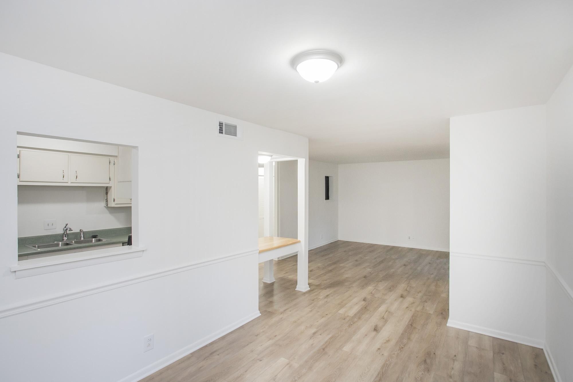 312 Summit Ridge Circle Nashville, TN 37215 - Photo 12 of 36 a view of an empty room with wooden floor and a window