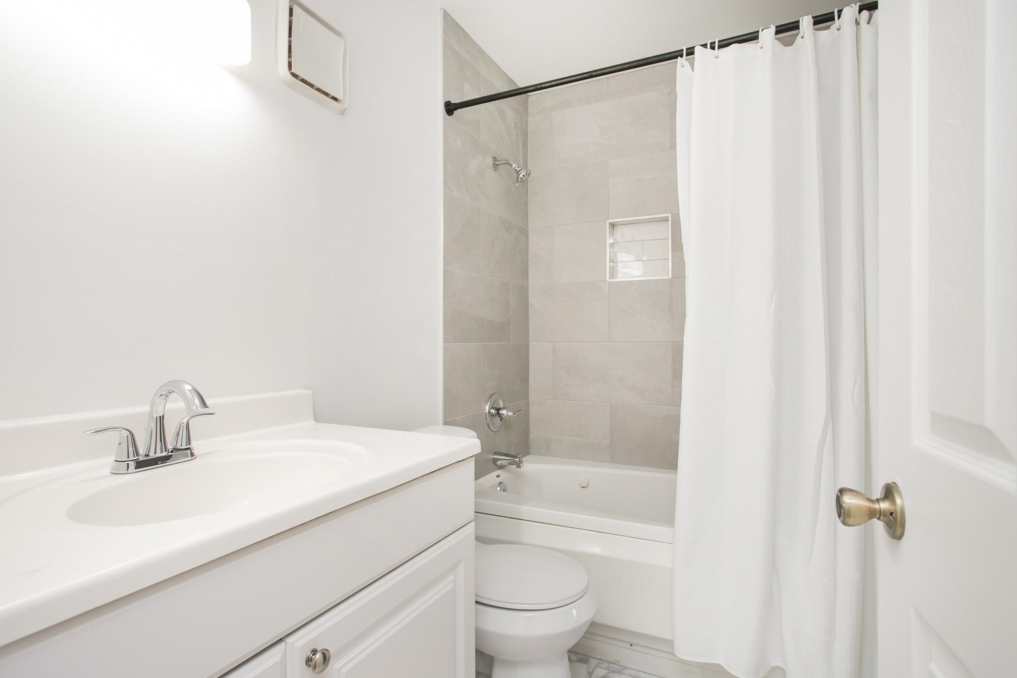 312 Summit Ridge Circle Nashville, TN 37215 - Photo 17 of 36 a bathroom with a sink a toilet and shower