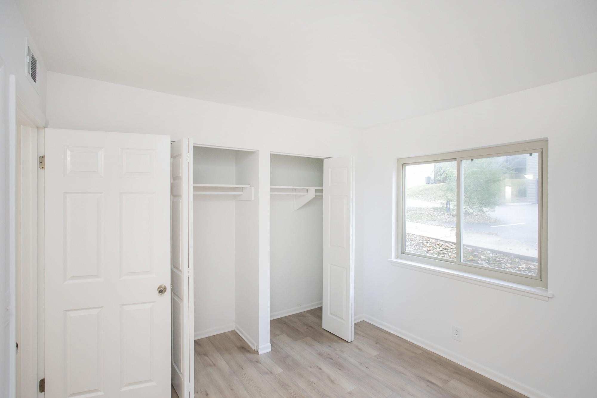 312 Summit Ridge Circle Nashville, TN 37215 - Photo 18 of 36 a view of an empty room with wooden floor and a window