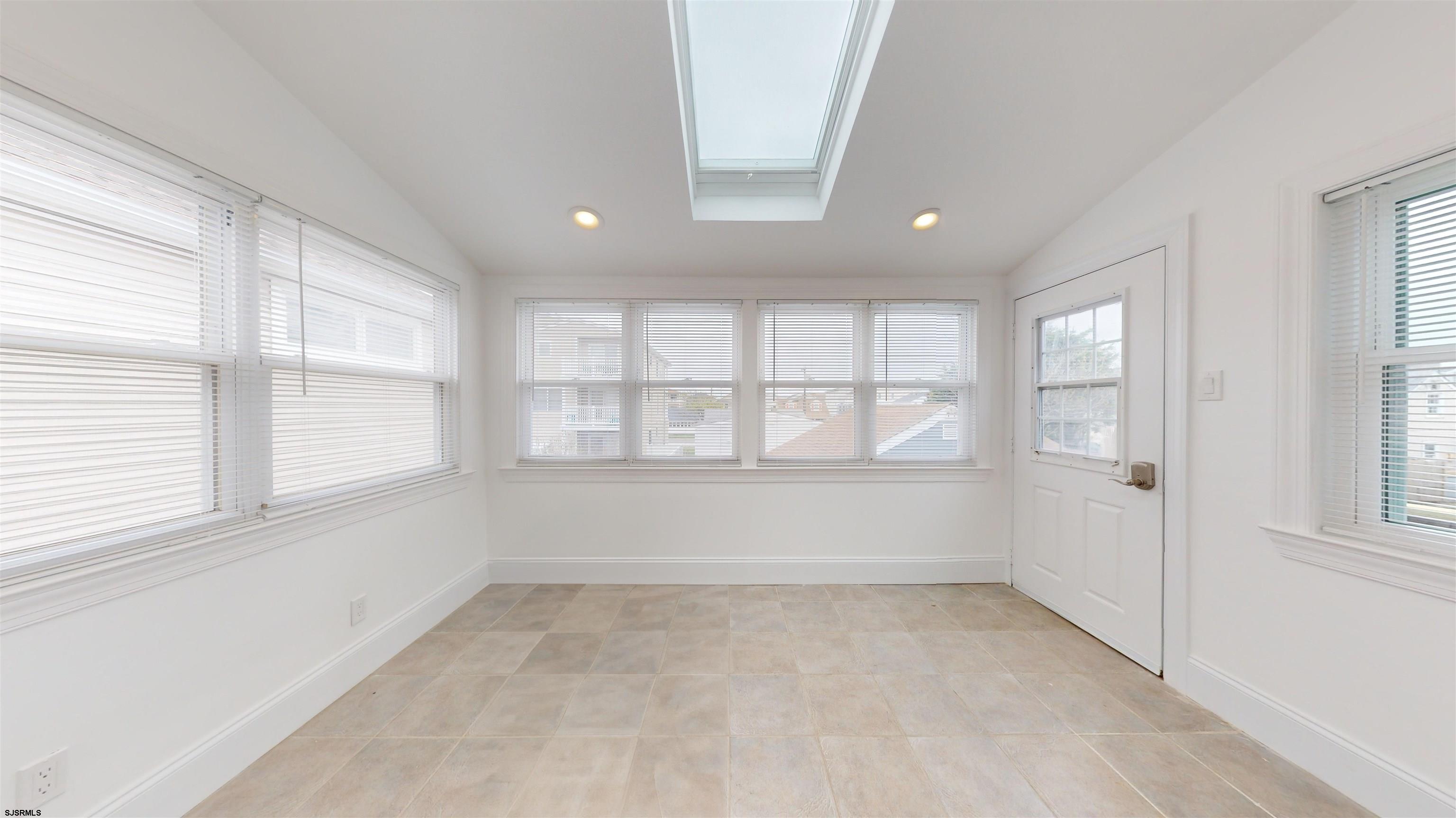 251 7th Street South, Unit 2 Brigantine, NJ 08203 - Photo 11 of 21 a view of an empty room with a window