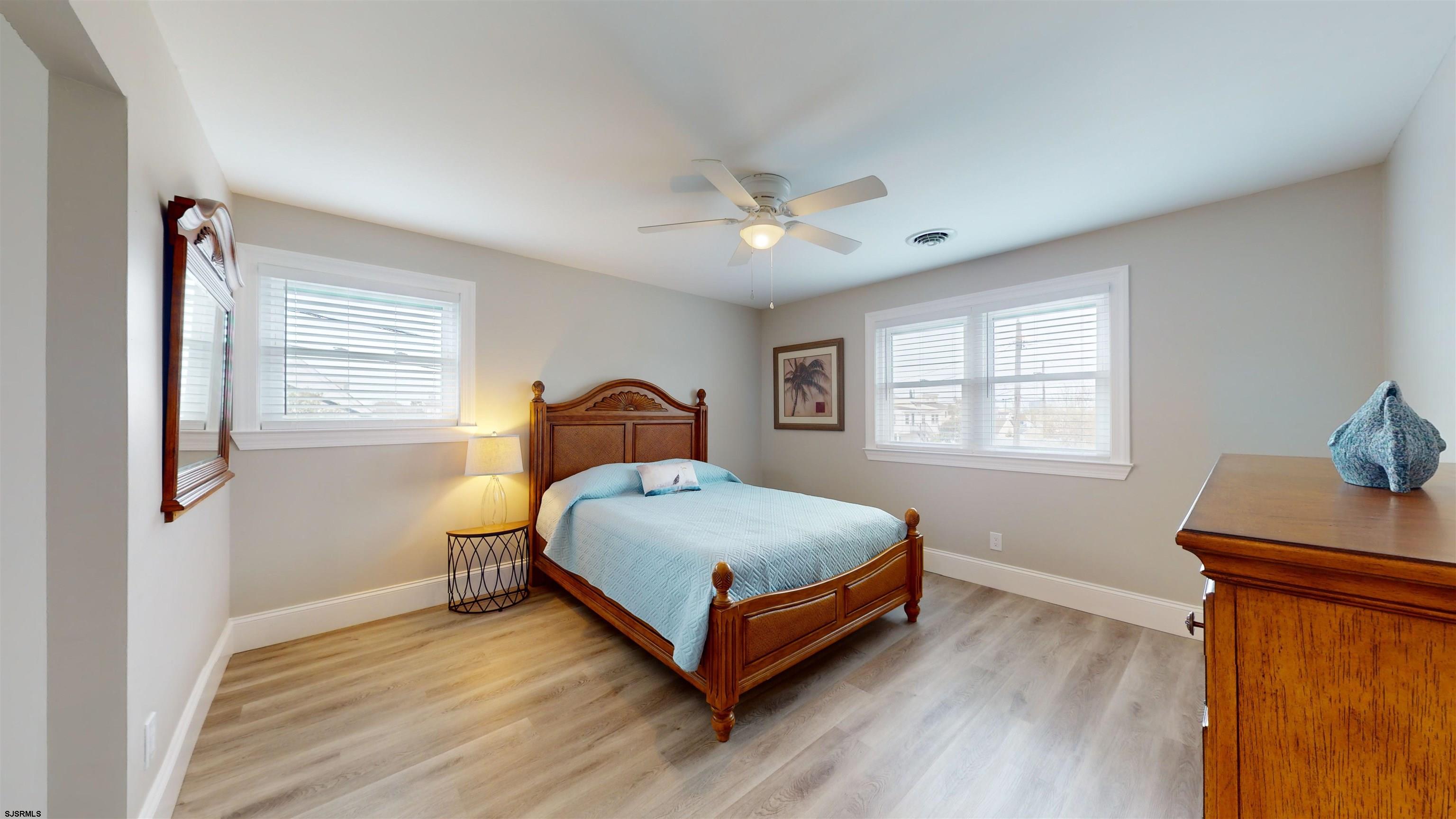 251 7th Street South, Unit 2 Brigantine, NJ 08203 - Photo 13 of 21 a bedroom with a bed and window