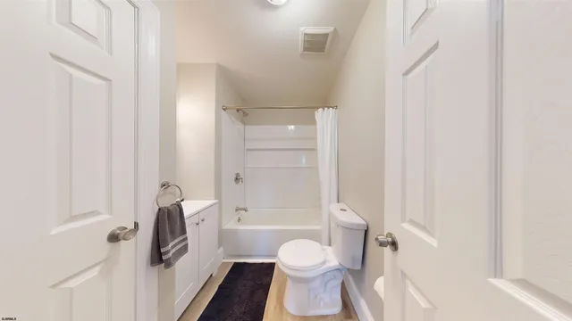 a bathroom with a toilet and shower