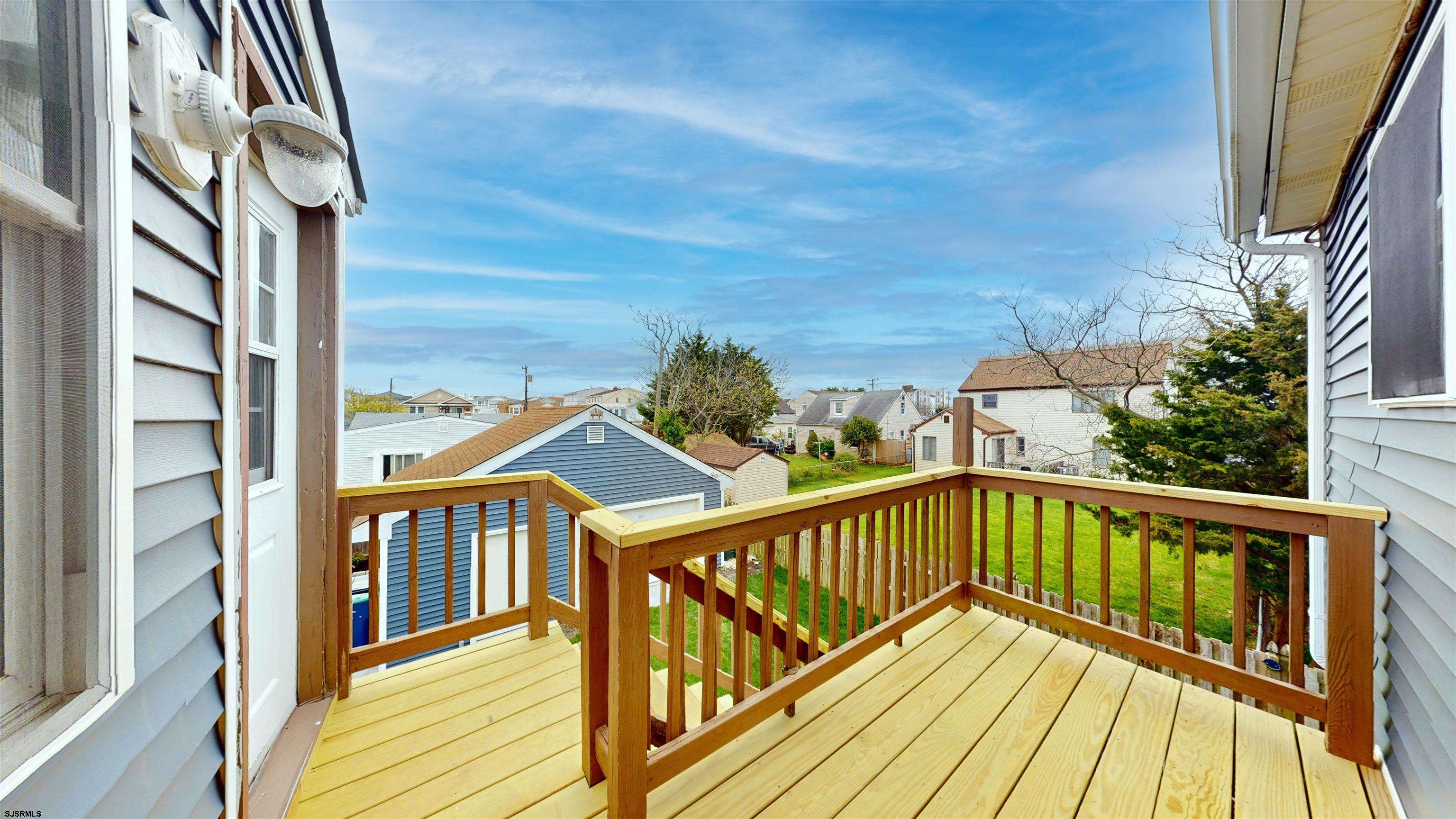 251 7th Street South, Unit 2 Brigantine, NJ 08203 - Photo 5 of 21 a view of balcony with wooden floor