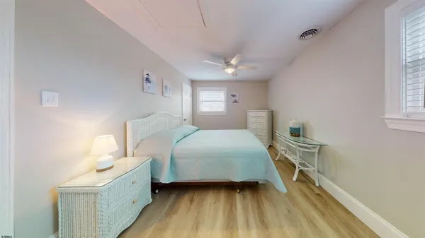 a bedroom with a bed and a table