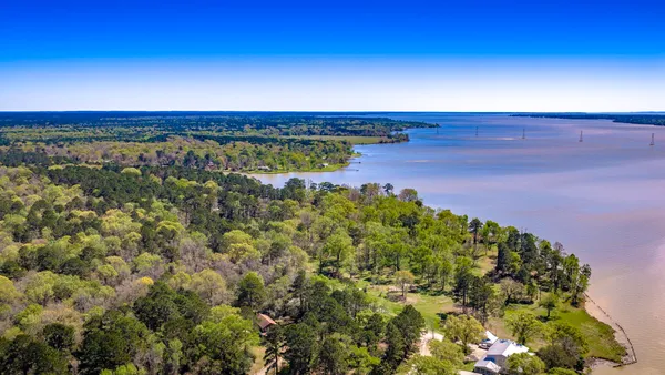 a view of a yard with an ocean view