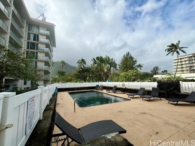 a terrace with outdoor seating and city view