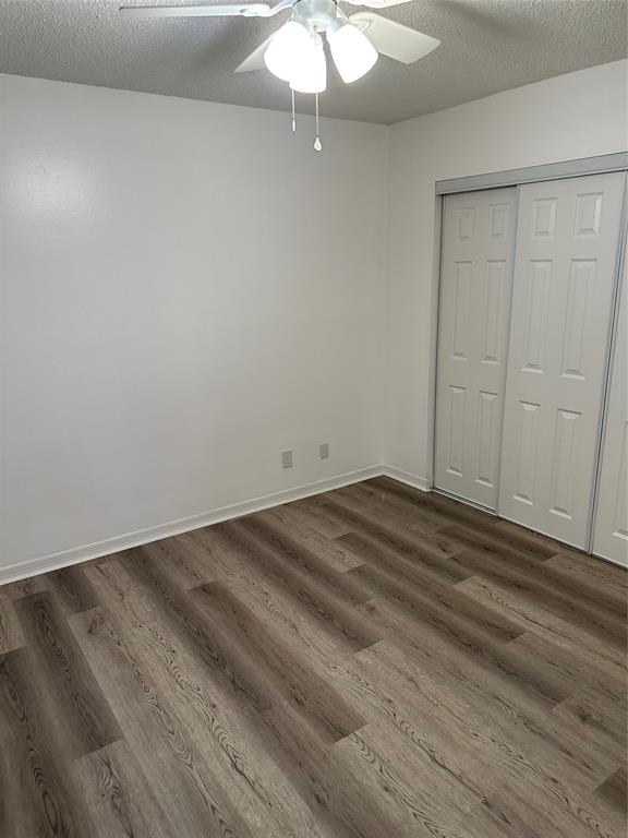 2825 Stoneway Lane Fort Pierce, FL 34982 - Photo 5 of 8 a view of a room with wooden floor and fan