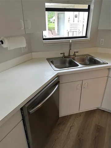 a kitchen with a sink and cabinets