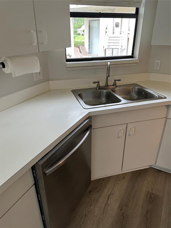 2825 Stoneway Lane Fort Pierce, FL 34982 - Photo 8 of 8 a kitchen with a sink and cabinets