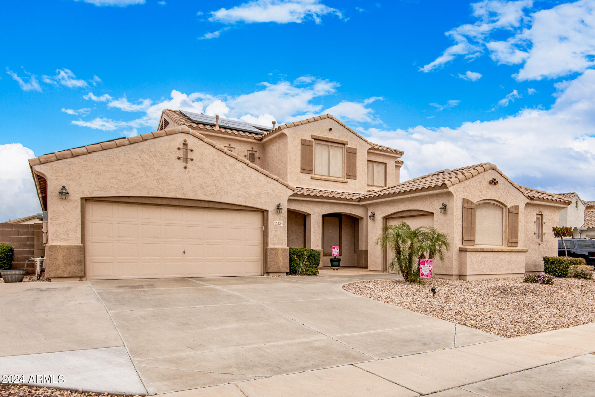 15224 West Redfield Road Surprise, AZ 85379 - Photo 1 of 28 a view of a white house with large windows