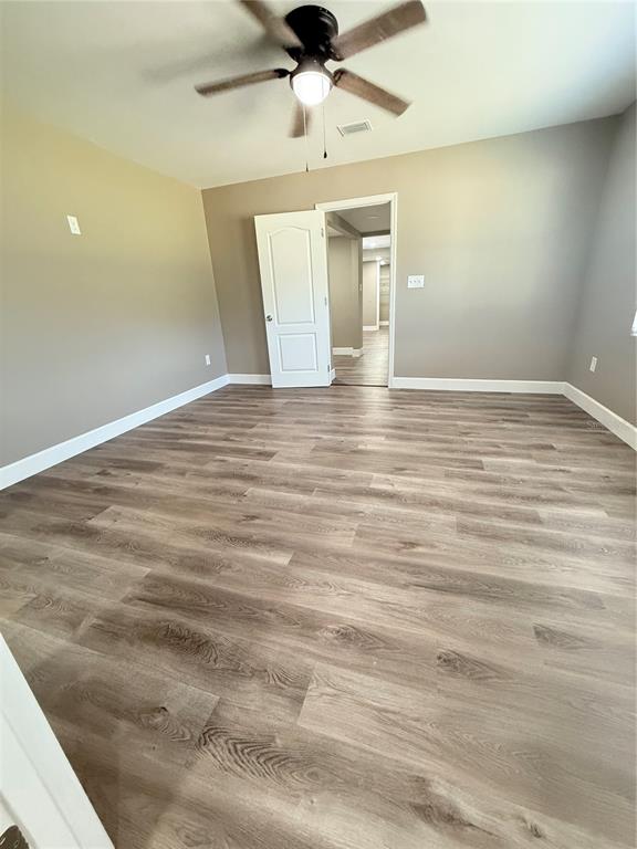 426 Becton Street Frostproof, FL 33843 - Photo 24 of 49 a view of empty room with wooden floor