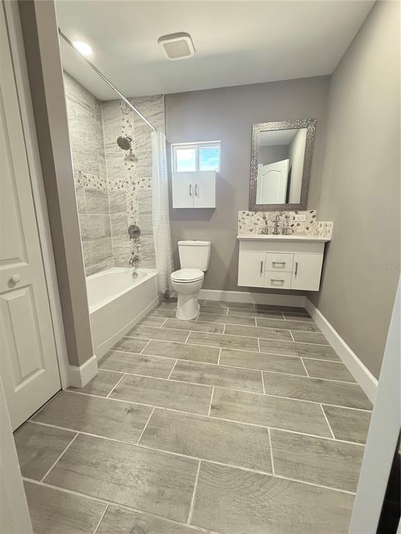 426 Becton Street Frostproof, FL 33843 - Photo 25 of 49 a bathroom with a sink toilet and shower