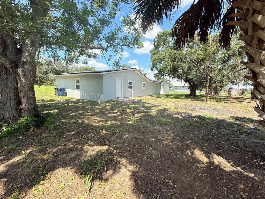 426 Becton Street Frostproof, FL 33843 - Photo 33 of 49 a view of a house with a yard
