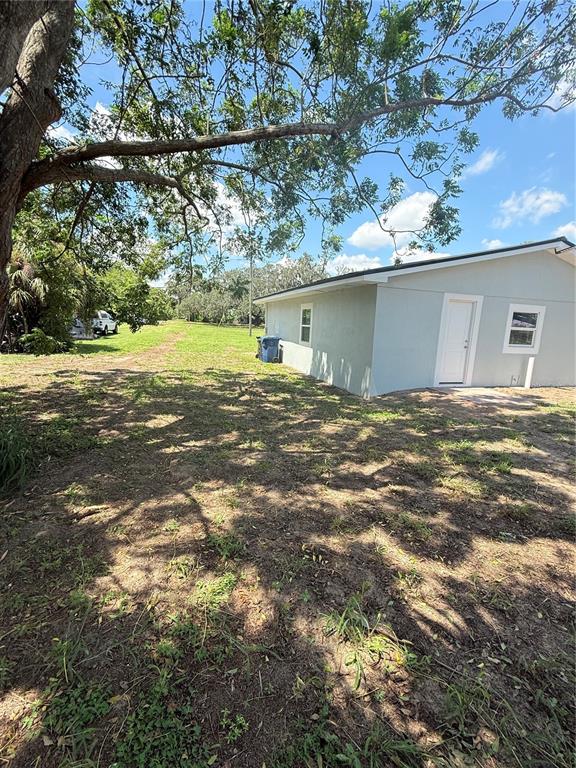 426 Becton Street Frostproof, FL 33843 - Photo 34 of 49 a view of a house with a yard