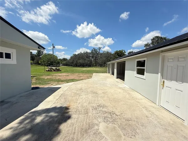 a view of a porch with a yard