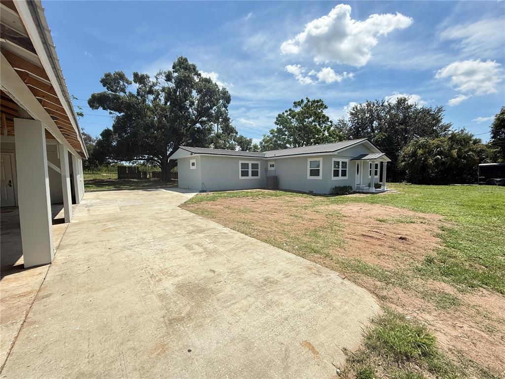 426 Becton Street Frostproof, FL 33843 - Photo 37 of 49 a view of a house with a yard