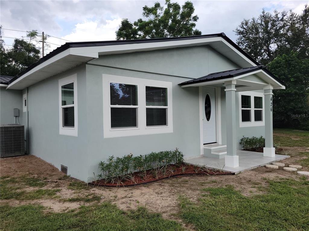 426 Becton Street Frostproof, FL 33843 - Photo 47 of 49 a front view of a house with garden