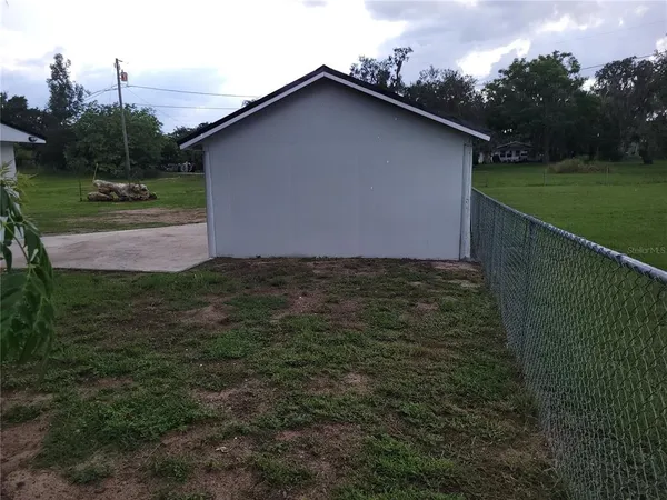 a backyard of a house with lots of green space