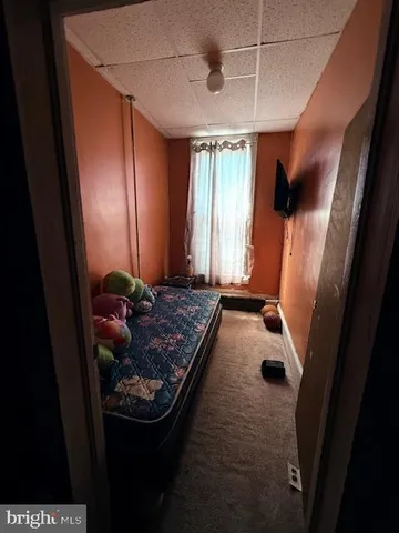 a room with furniture and musical instruments