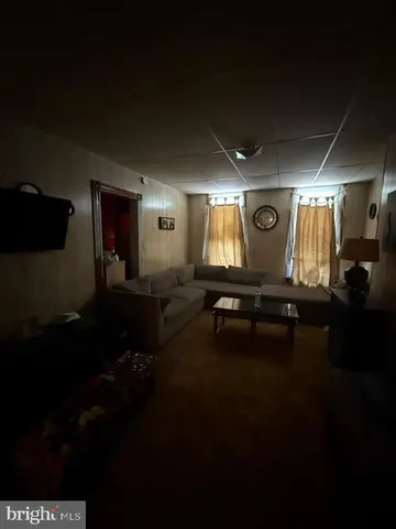 a room with a bed and a mirror