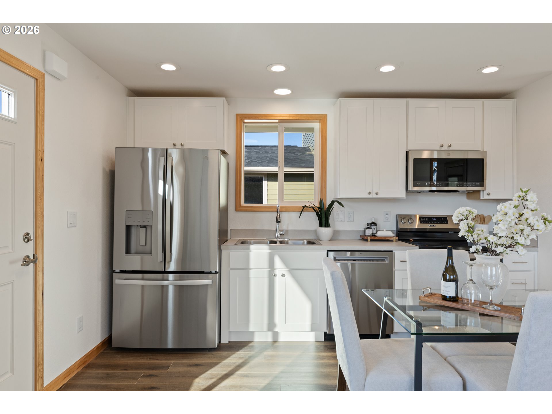 749 ST Charles Street Eugene, OR 97402 - Photo 29 of 37 a kitchen with refrigerator cabinets and wooden floor