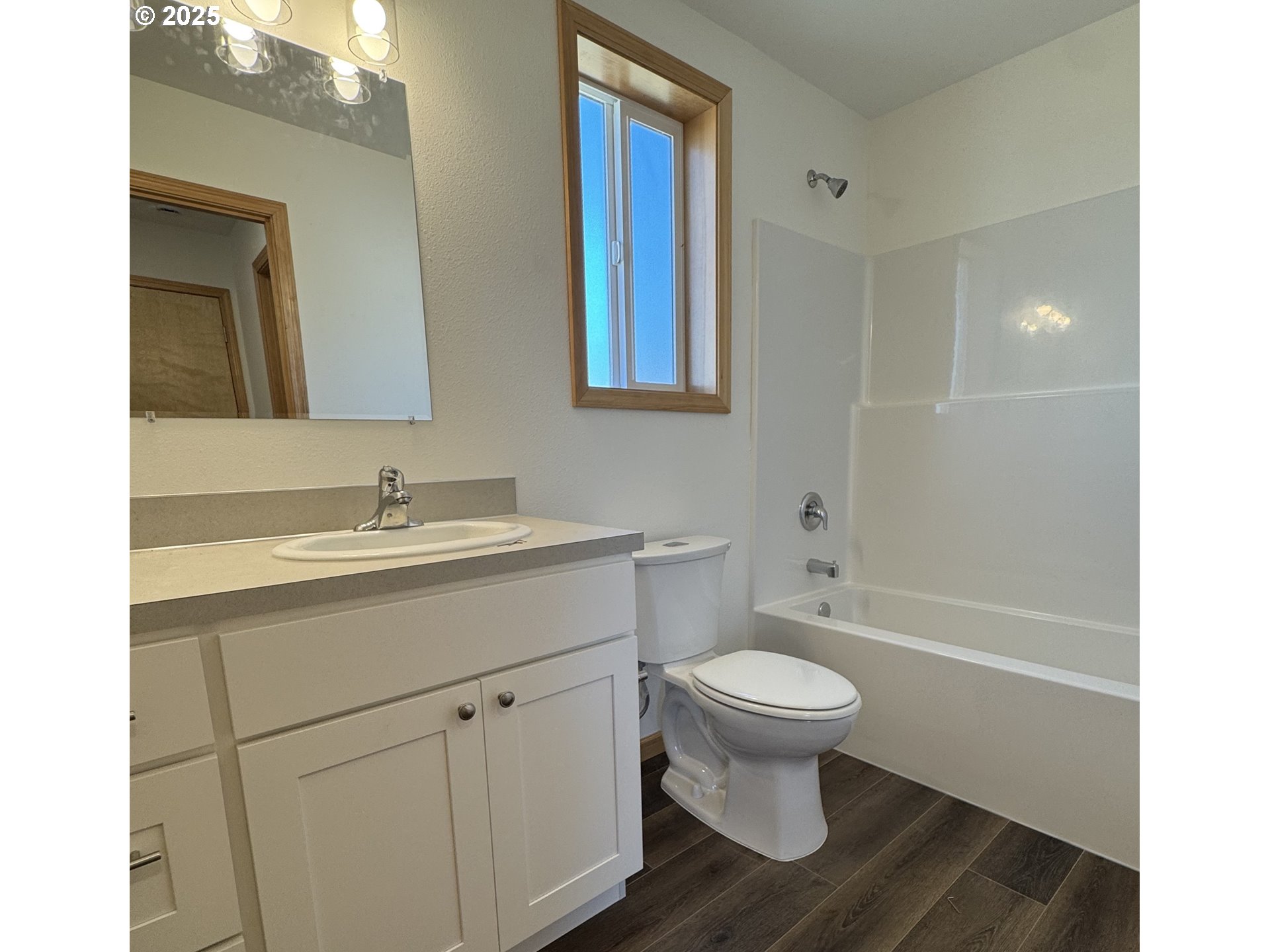 749 ST Charles Street Eugene, OR 97402 - Photo 6 of 37 a bathroom with a toilet sink and mirror