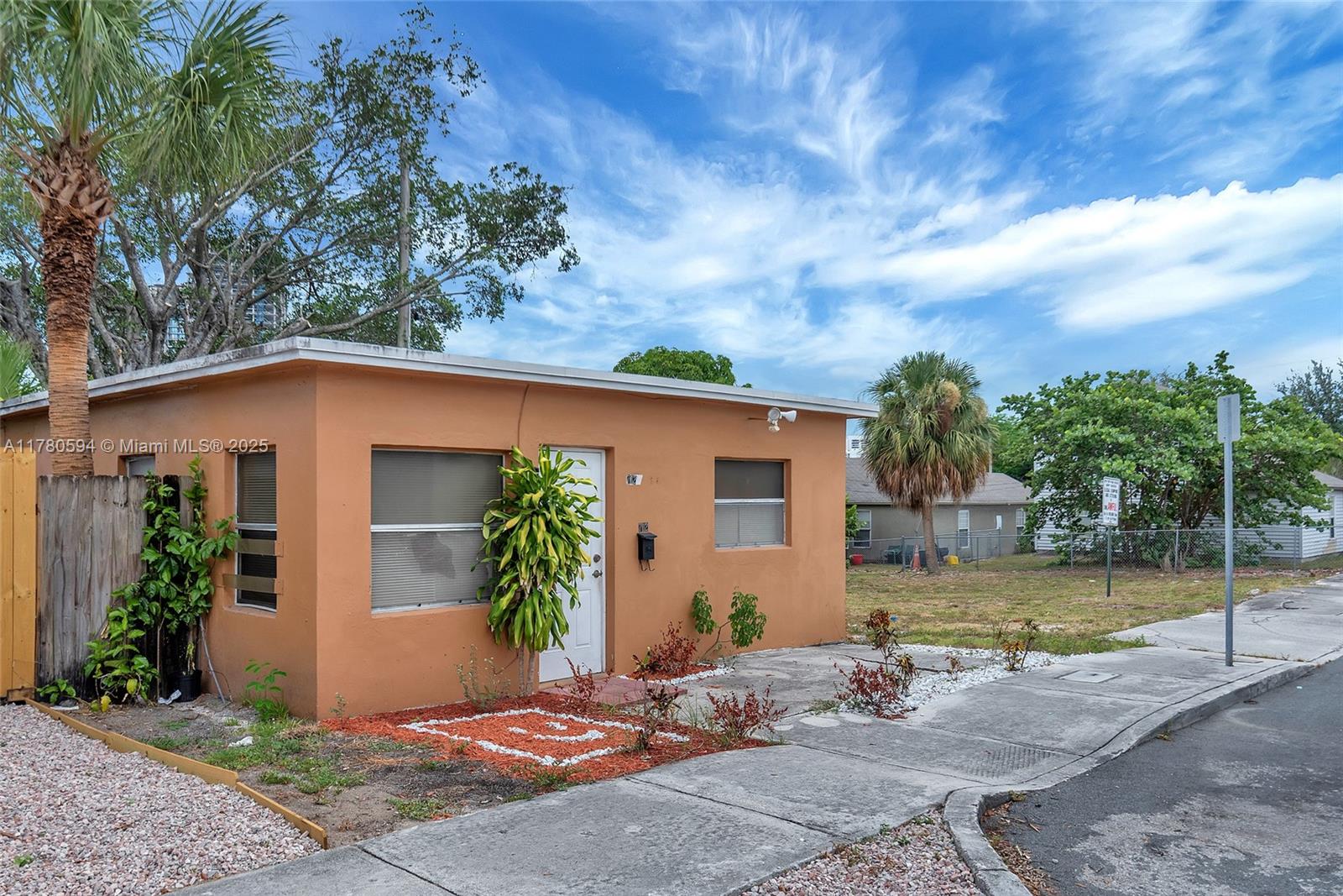 712 Division Avenue West Palm Beach, FL 33401 - Photo 15 of 37 front view of a house with a yard