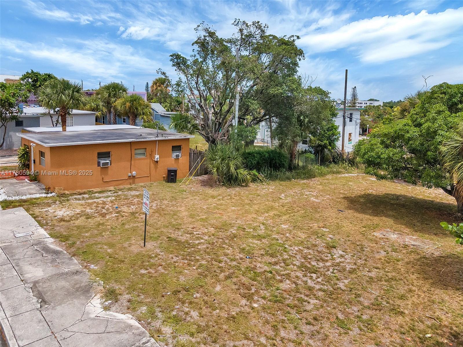 712 Division Avenue West Palm Beach, FL 33401 - Photo 18 of 37 a front view of a house with a yard