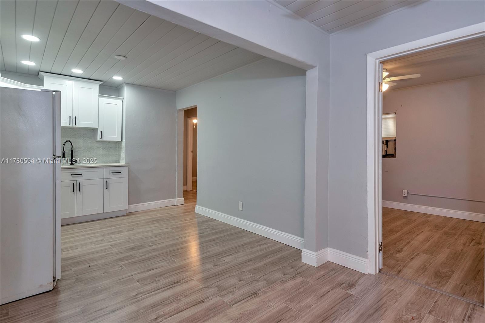 712 Division Avenue West Palm Beach, FL 33401 - Photo 20 of 37 a view of a kitchen with wooden floor and a sink