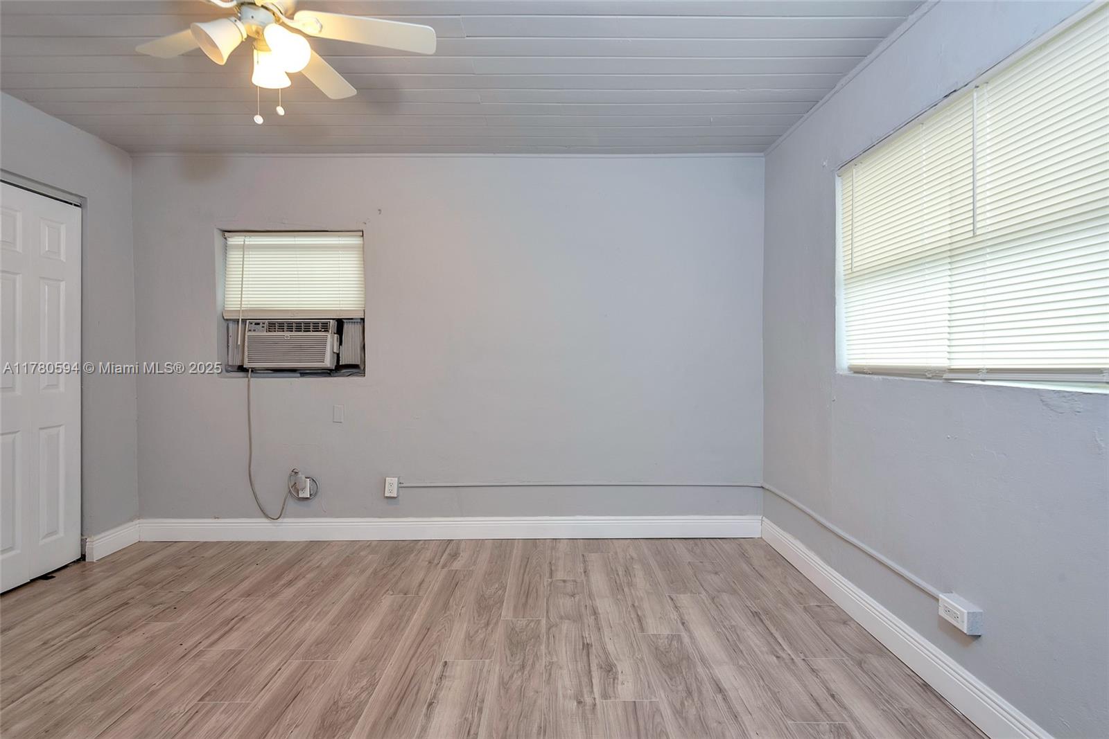 712 Division Avenue West Palm Beach, FL 33401 - Photo 27 of 37 wooden floor in an empty room with a window