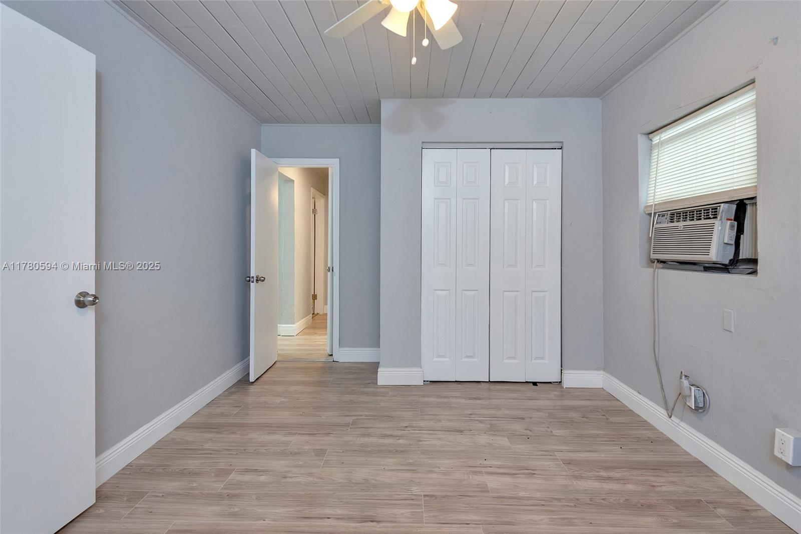 712 Division Avenue West Palm Beach, FL 33401 - Photo 28 of 37 a view of a room with wooden floor and a ceiling fan