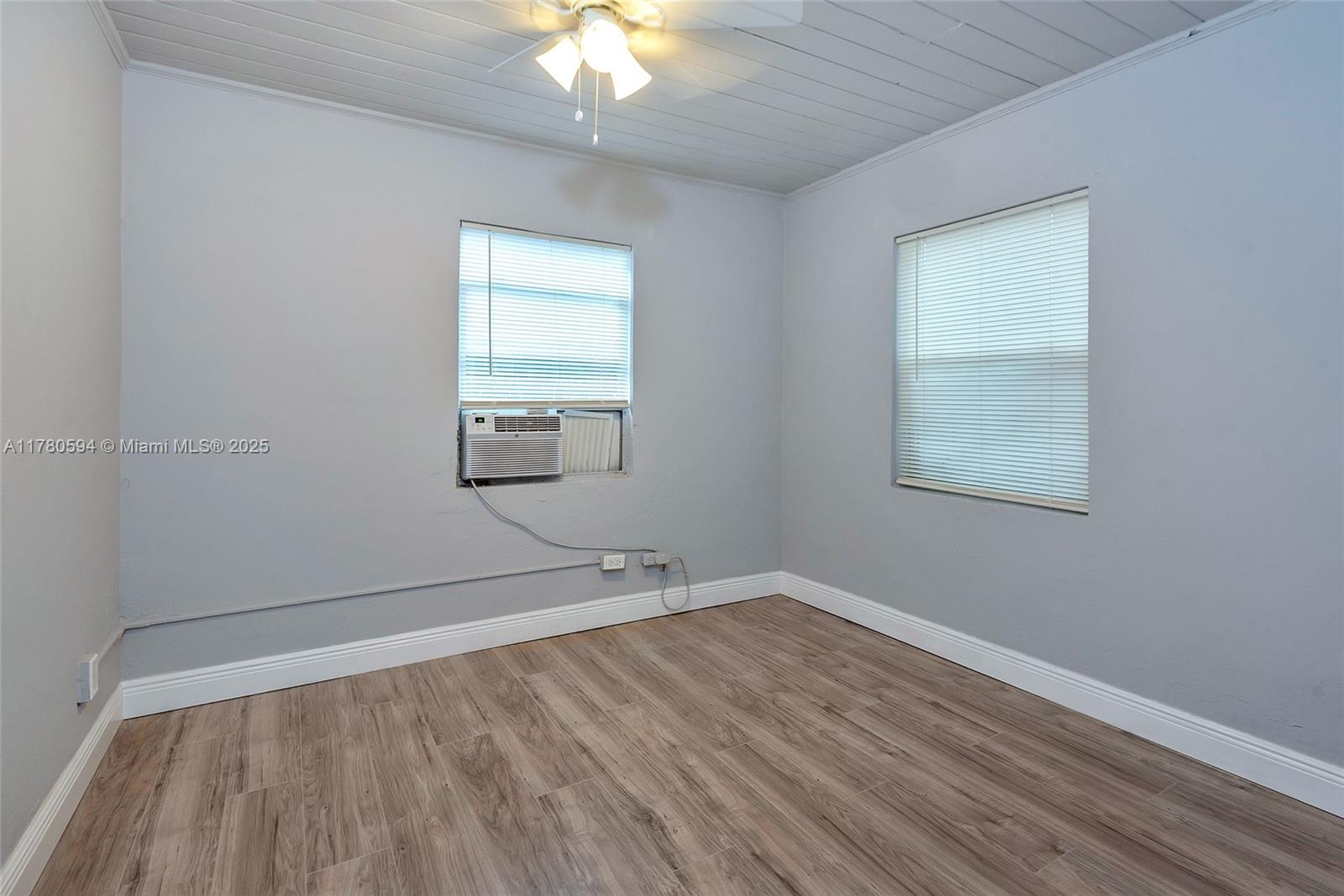 712 Division Avenue West Palm Beach, FL 33401 - Photo 32 of 37 wooden floor in an empty room with a window