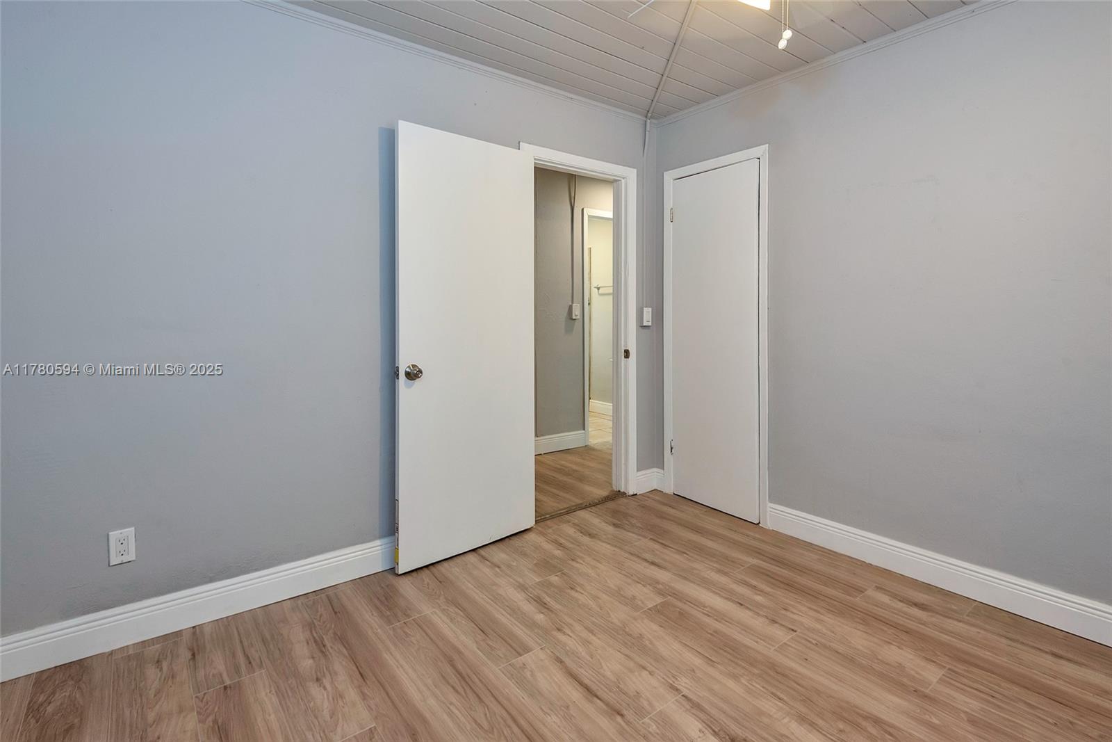 712 Division Avenue West Palm Beach, FL 33401 - Photo 33 of 37 a view of an empty room with wooden floor