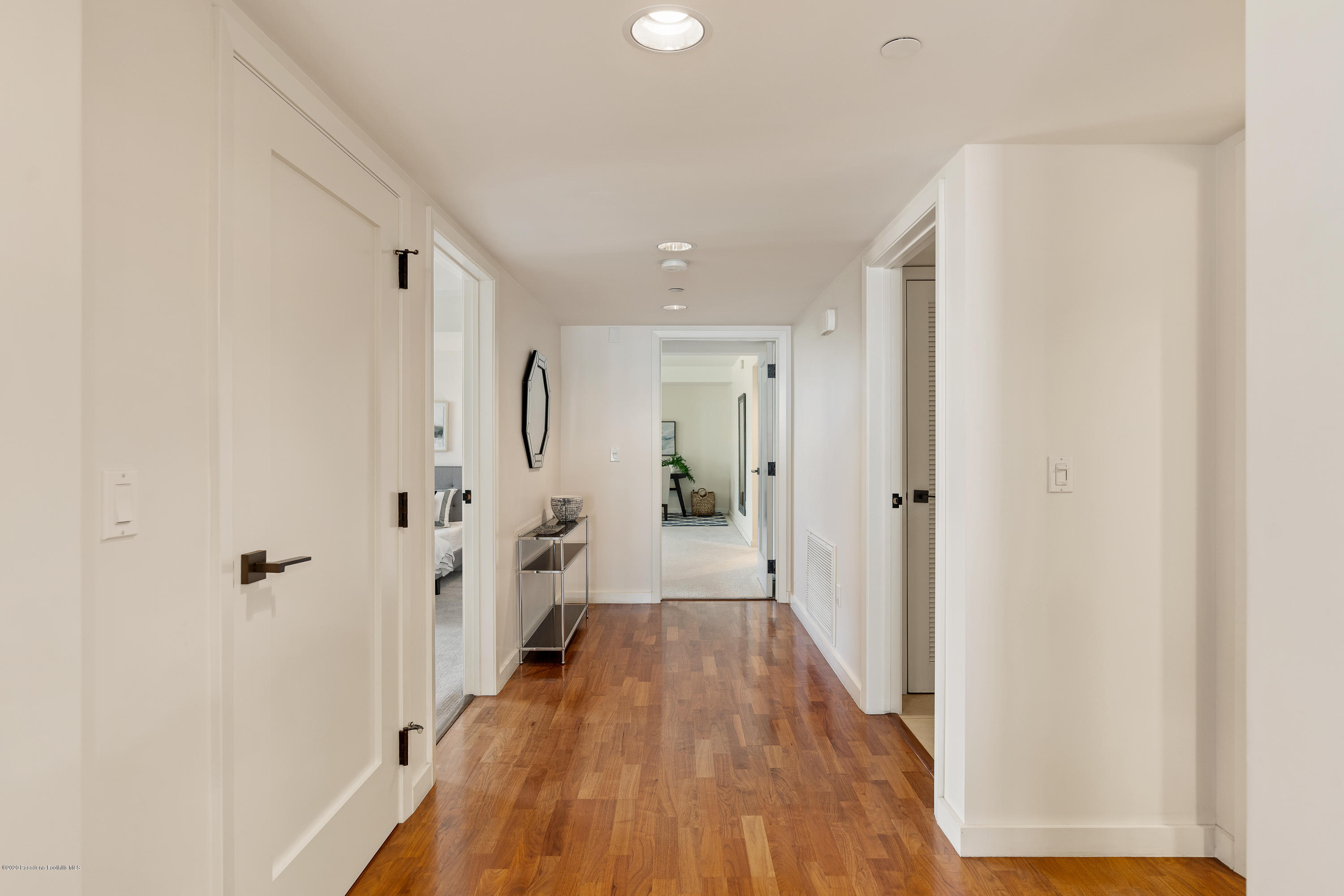 920 Granite Drive, Unit 309 Pasadena, CA 91101 - Photo 15 of 40 a view of a hallway with wooden floor and a bathroom