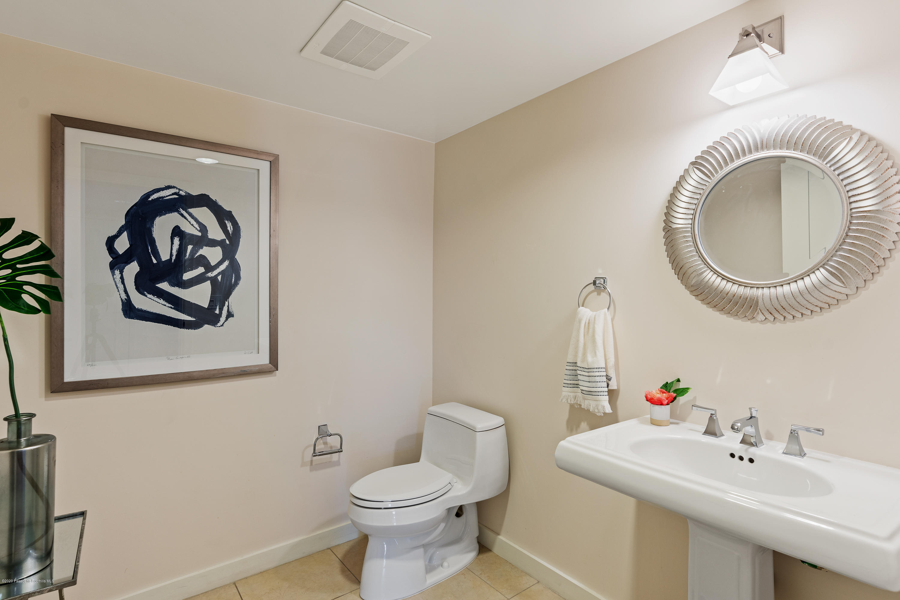 920 Granite Drive, Unit 309 Pasadena, CA 91101 - Photo 16 of 40 a bathroom with a toilet a sink and a mirror