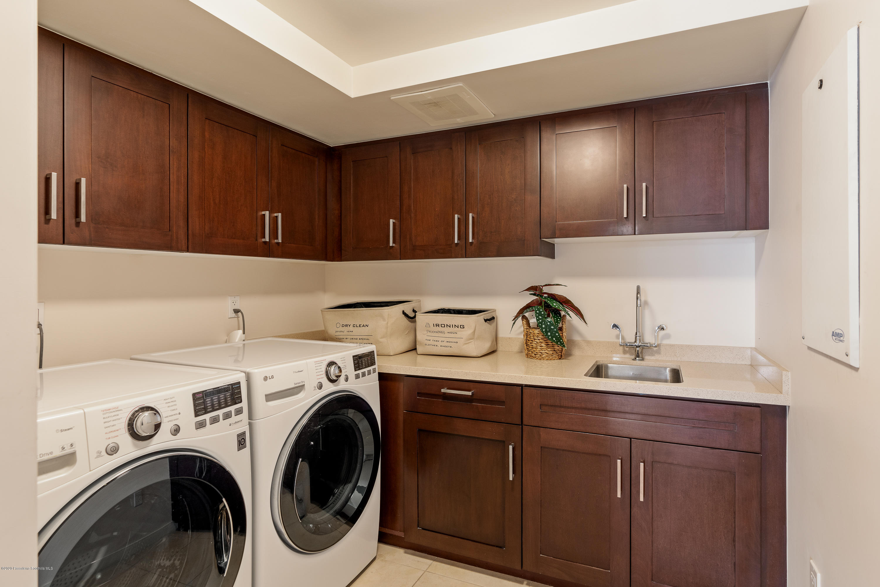 920 Granite Drive, Unit 309 Pasadena, CA 91101 - Photo 17 of 40 a view of cabinets with washer and dryer