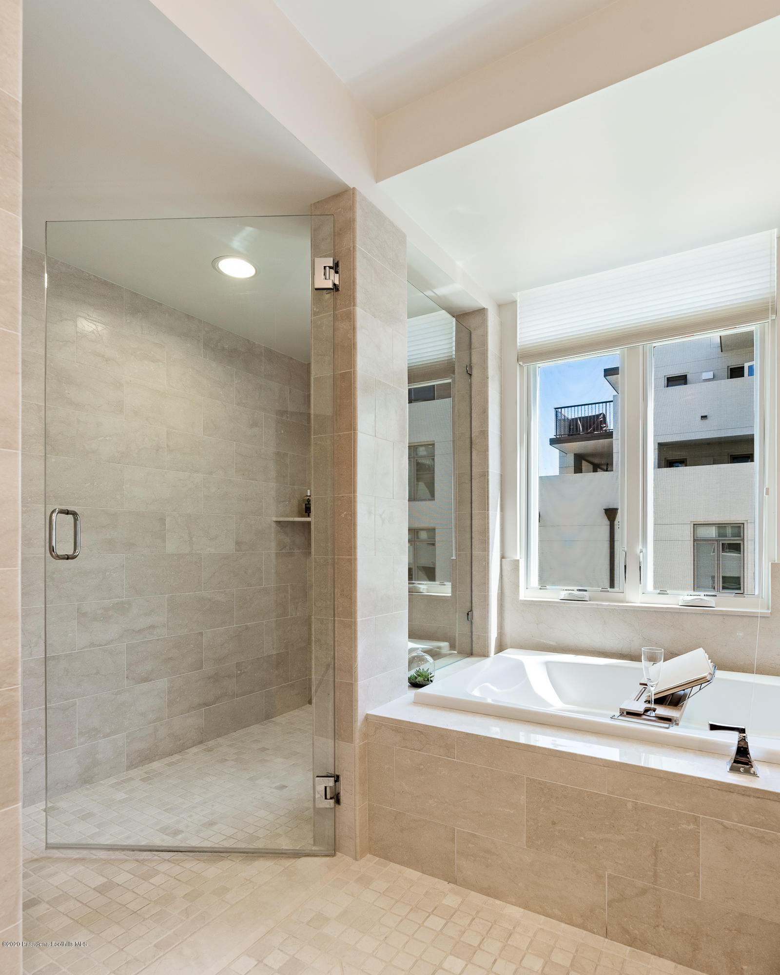 920 Granite Drive, Unit 309 Pasadena, CA 91101 - Photo 25 of 40 a bathroom with a bathtub and a shower