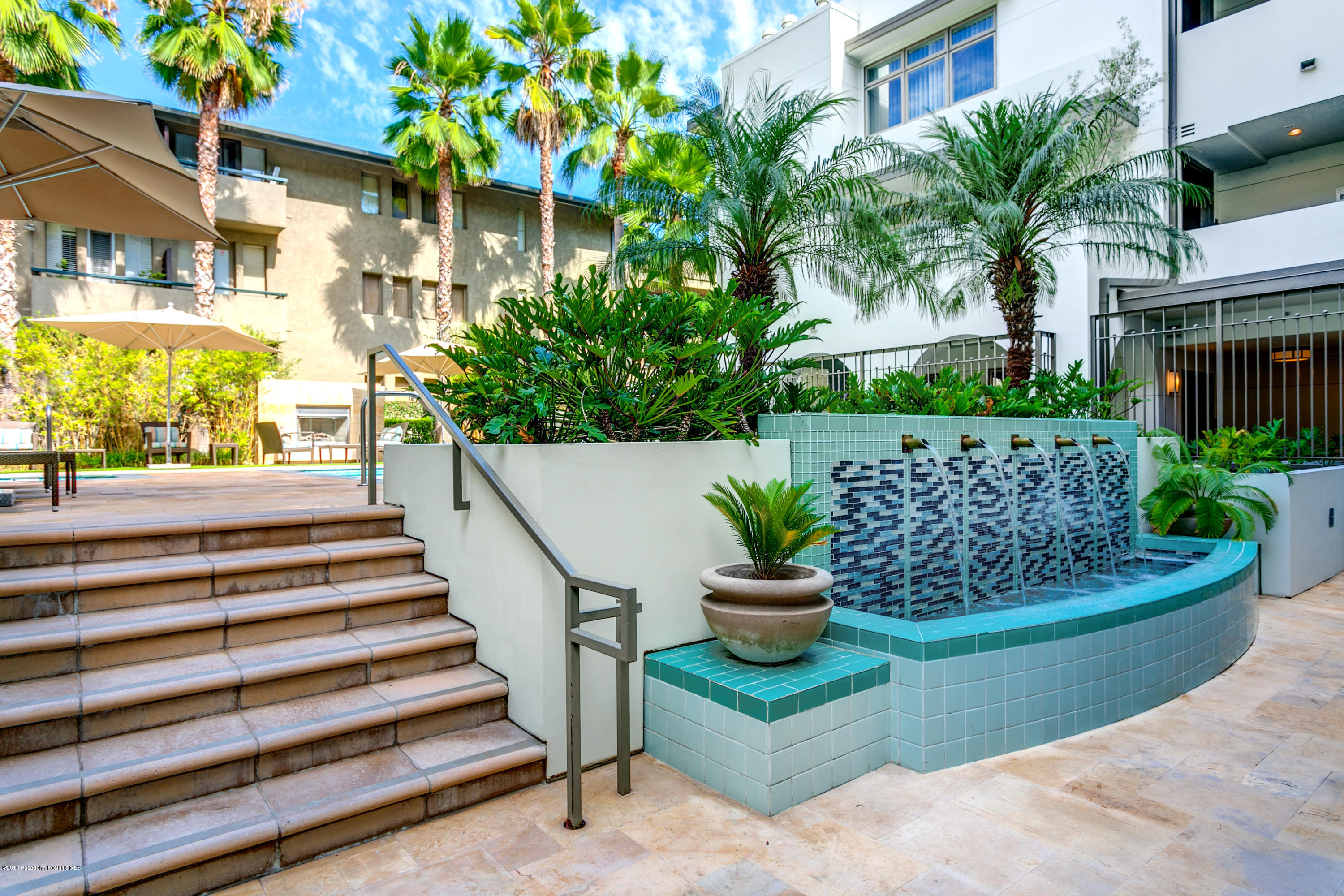 920 Granite Drive, Unit 309 Pasadena, CA 91101 - Photo 34 of 40 a view of a house with a yard and potted plants