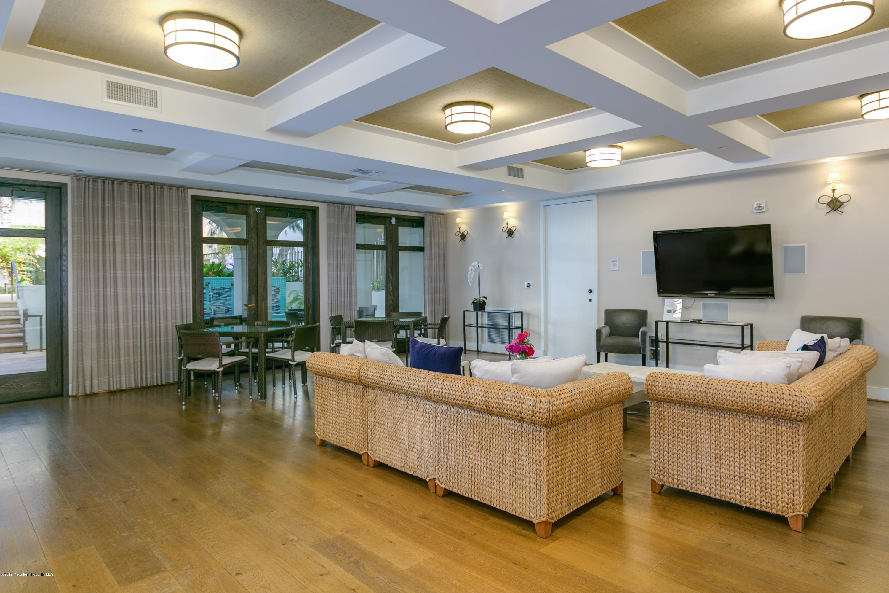 920 Granite Drive, Unit 309 Pasadena, CA 91101 - Photo 37 of 40 a living room with furniture and a flat screen tv