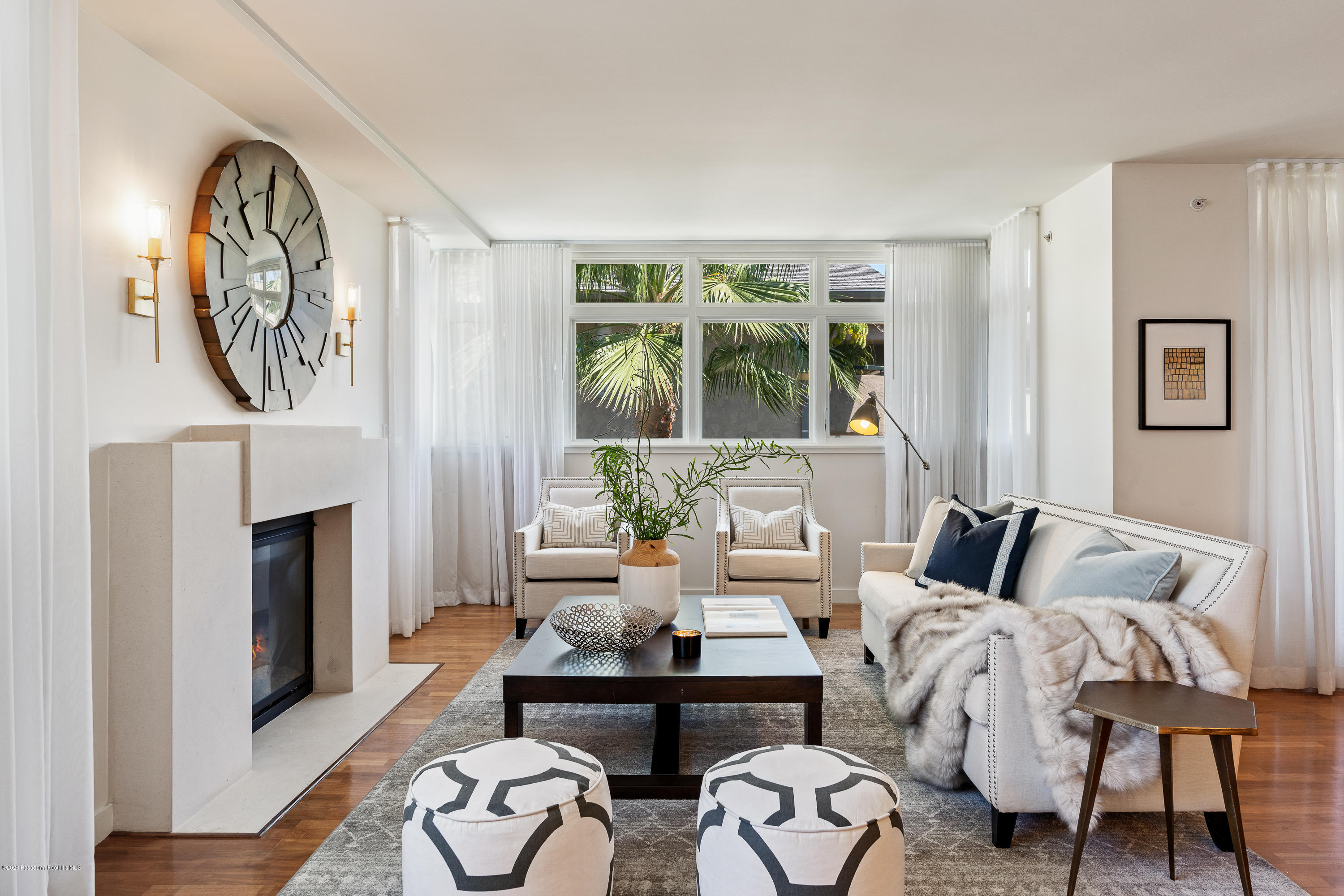 920 Granite Drive, Unit 309 Pasadena, CA 91101 - Photo 4 of 40 a bedroom with furniture and a fireplace