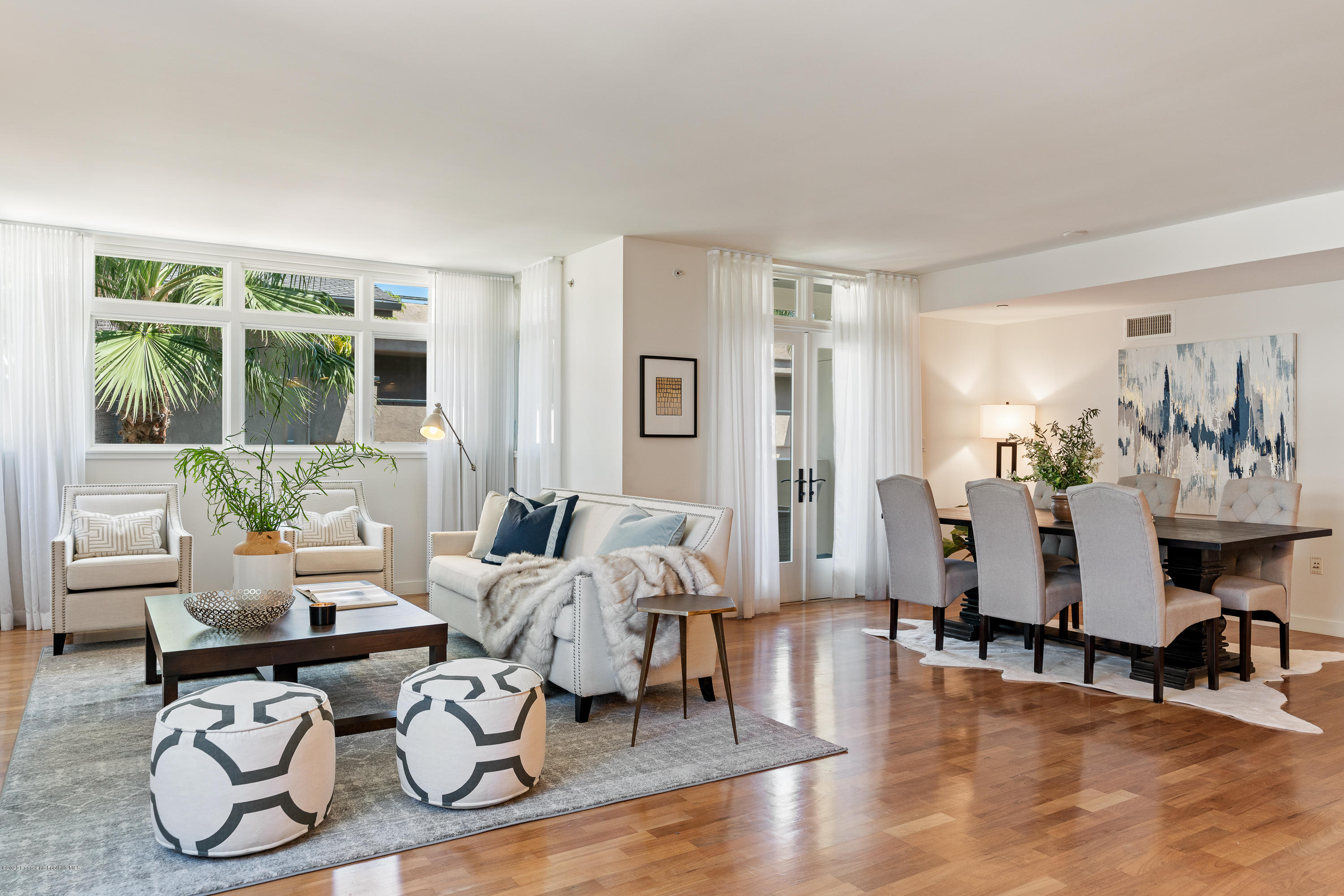 920 Granite Drive, Unit 309 Pasadena, CA 91101 - Photo 5 of 40 a living room with furniture a dining table and a large window