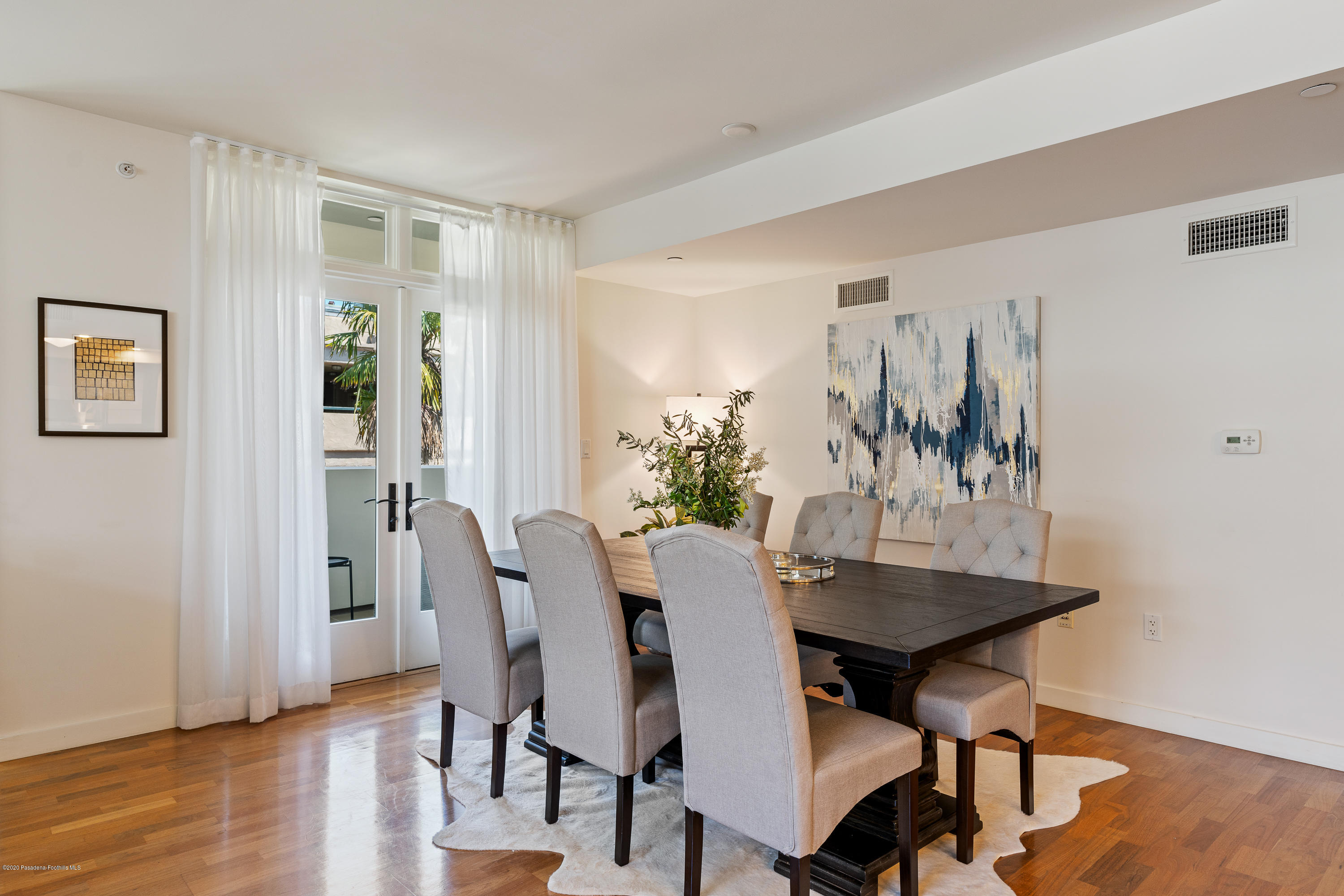 920 Granite Drive, Unit 309 Pasadena, CA 91101 - Photo 6 of 40 a view of a dining room with furniture and wooden floor